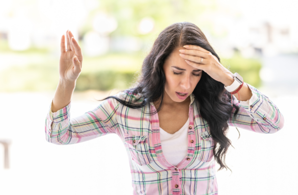 Woman with headache looking for treatment with Chinese Herbal Medicine in Vancouver